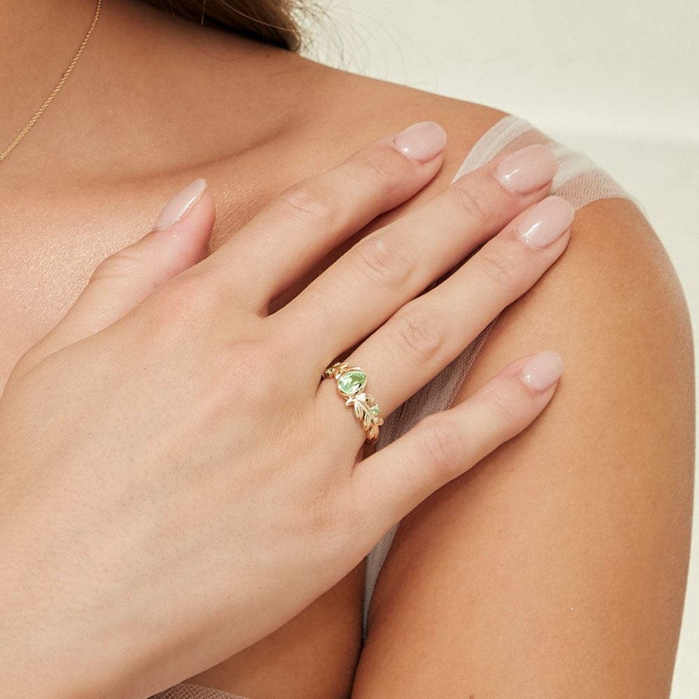 135R2092019 O Leaf Peridot Ring In 9ct Yellow Gold On Model