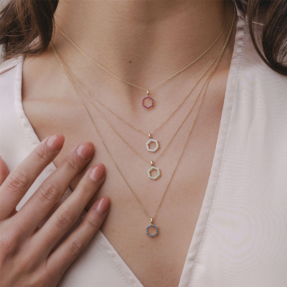 Geometric Hex Emerald Pendant Necklace in 9ct Yellow Gold On Model