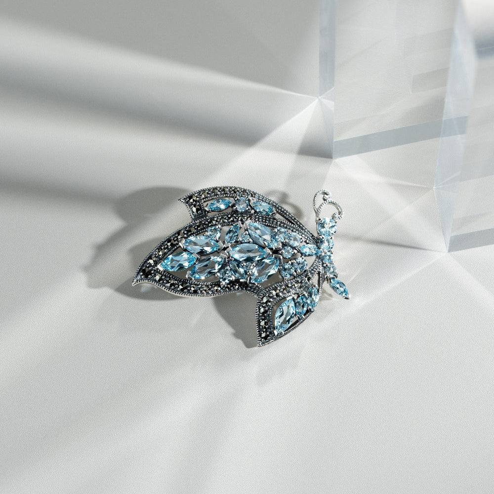 Art Nouveau Style Marquise Blue Topaz & Marcasite Flying Butterfly Brooch in 925 Sterling Silver flatlay