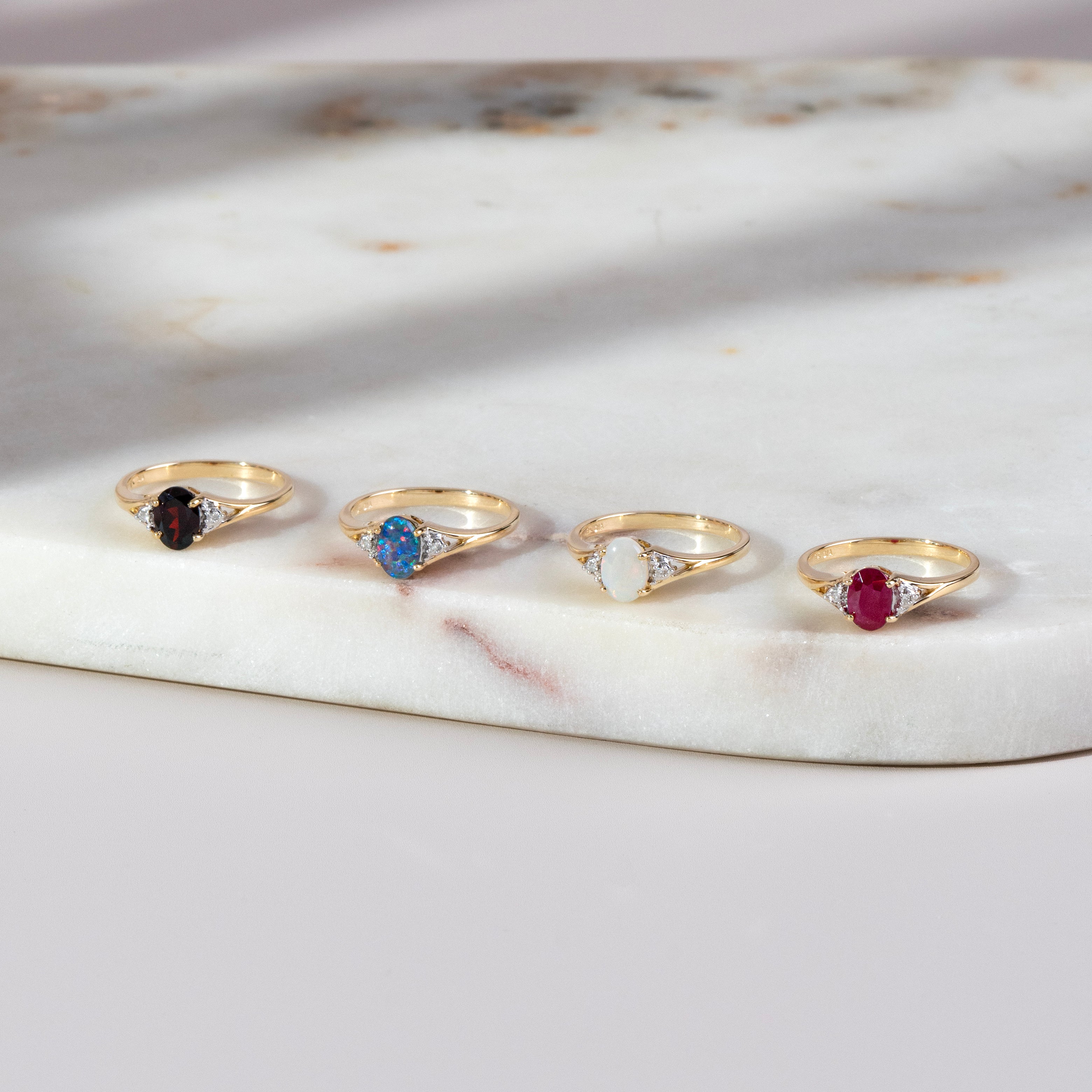 classic-oval-garnet-diamond-ring-in-9ct-yellow-gold-25457 on model