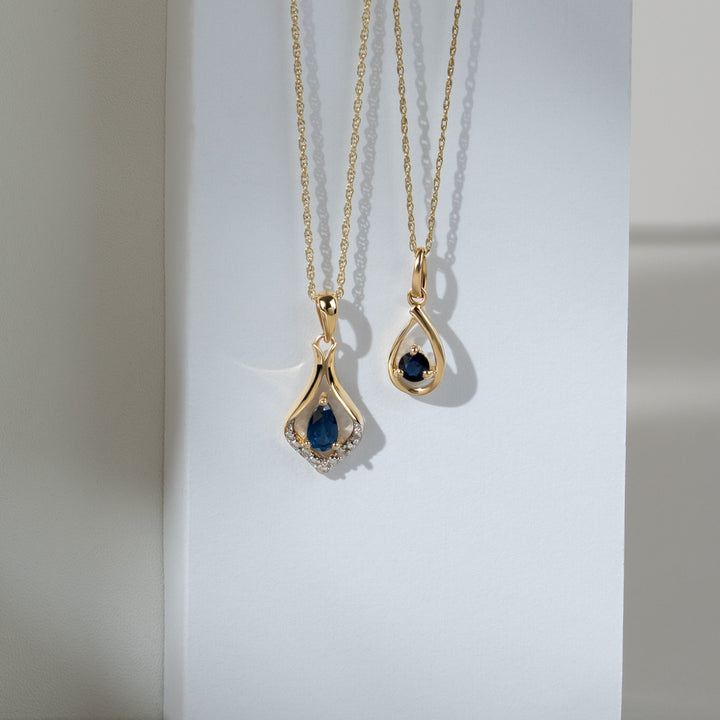 Classic Pear Sapphire & Three Diamond Leaf Halo Pendant in 9ct Yellow Gold