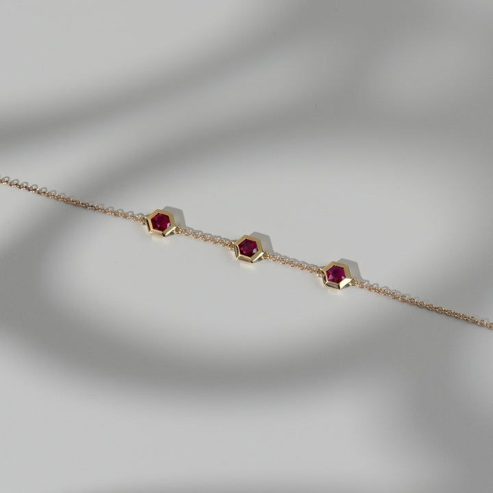 Geometric Hexagon Ruby Bezel Set Three Stone Bracelet in 9ct Yellow Gold