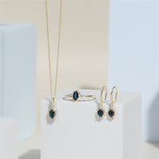 Classic Oval Sapphire & Round Diamond Ring In 9ct Yellow Gold